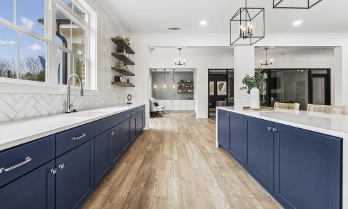 a kitchen with an island and chairs a kitchen with an island and chairs