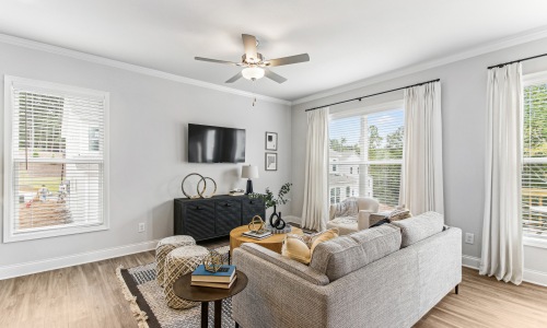 Spacious living areas to recline and recharge living room with couches tv and several windows